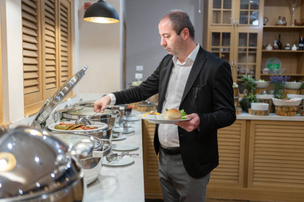 istock Businessman Have A Breakfast At Hotel Restaurant Buffet 2137826639