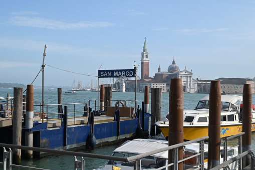 Venice, Italy, march 12, 2024 : St. Mark's mooring quay with the campanile and the San Giorgio Maggiore basilica in the background