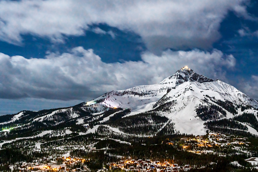 Skiing slopes in the foreground and Rocky Mountains in the background. This photograph was taken in Vail, Colorado.