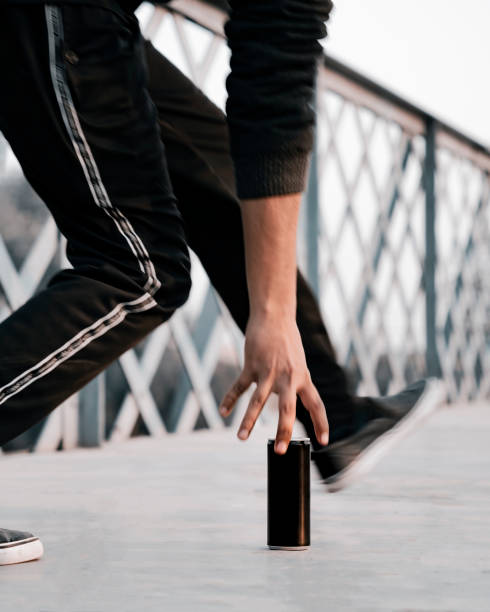 istock Boy is trying to pick energy drink while running 2137856085
