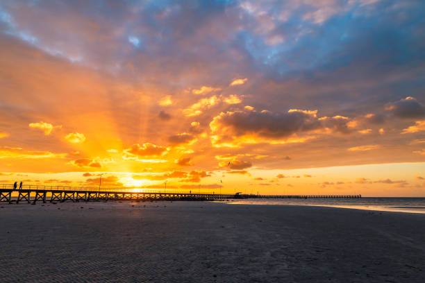 istock Moonta Bay jetty with people at sunset 2137891389