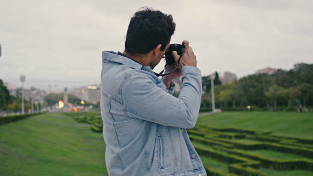 istock Creative photographer shooting nature park at summer evening closeup back view 2137891621