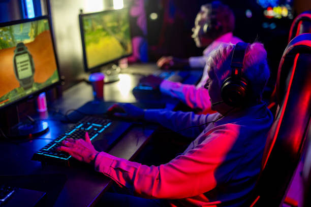 istock Senior woman playing video games 2137917749