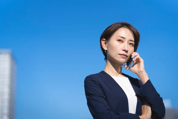 A middle-aged woman and the blue sky.