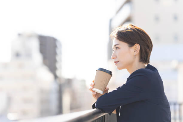 istock A woman is taking a break on the rooftop. 2137921954