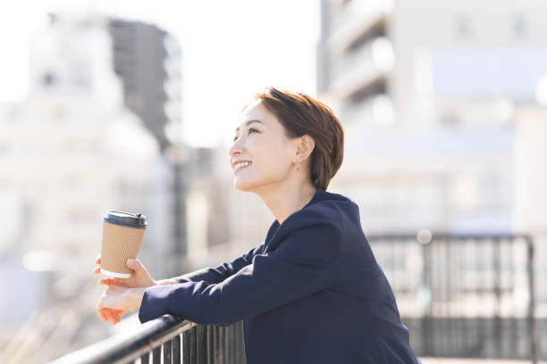 istock A woman is taking a break on the rooftop. 2137921955