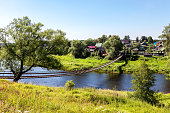 Suspension bridge across the Msta river next the Borovichi, Russia