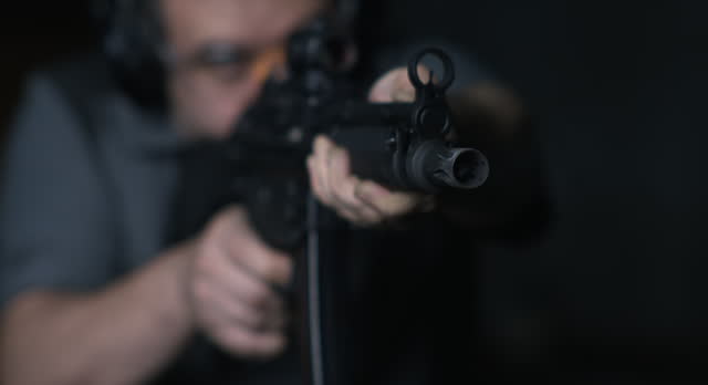 Close-Up of Man Firing Powerful Assault Rifle, 800fps High-Speed Slow-Motion Shooting Sequence