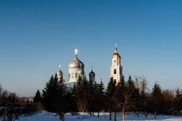 Trinity Cathedral in Diveevo Russia, chapel and bell tower against the background of the blue sky. High quality photo