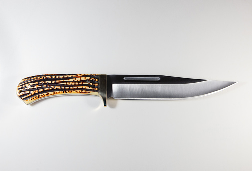 Intricately patterned knife blade on display
