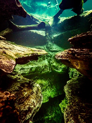 Scuba diver POV underwater in the spring vent at Blue Springs State Park, Volusia County, Florida