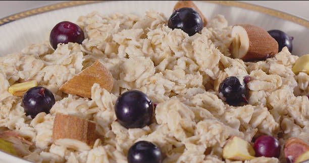 Oatmeal porridge with butter. The camera moves.