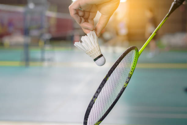 istock The badminton player holding a white shuttlecock and racket 2138025597