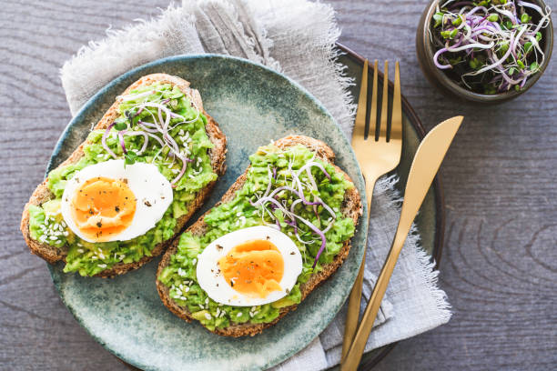 istock Healthy homemade rustic breakfast Toast With Avocado and Boiled Egg. 2138124573