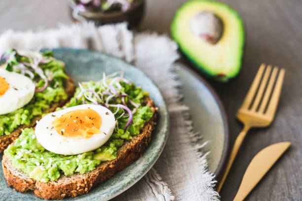 istock Healthy homemade rustic breakfast Toast With Avocado and Boiled Egg. 2138124576