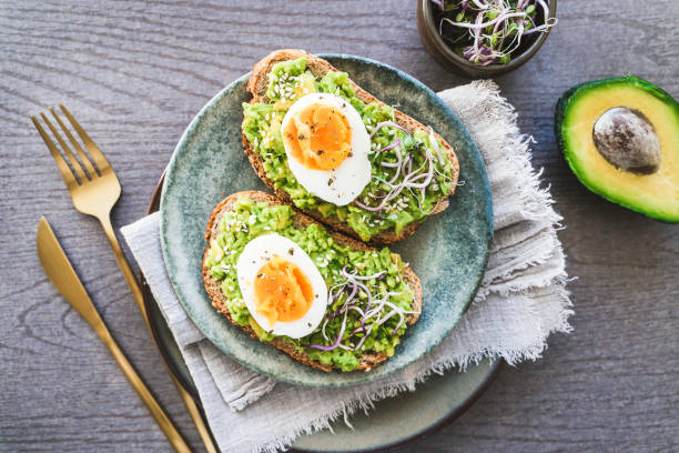 istock Healthy homemade rustic breakfast Toast With Avocado and Boiled Egg. 2138124585