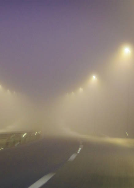 istock Foggy sky at empty highway driver pov 2138131502