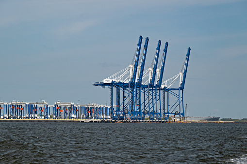 Charleston, SC, USA - April 01, 2024: Ship-to-shore cranes with a lift height of 169 feet and outreach of 228 feet at Hugh K. Leatherman Terminal on the Cooper River in Charleston Harbor.