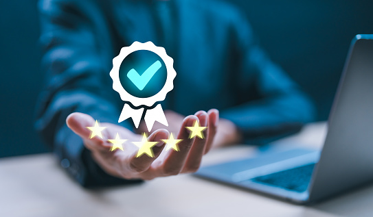 Businessman use laptop checklist customer satisfaction rating on digital document ,Customer Satisfaction Guarantee and digital checklist, Top service ISO Certification Document Management System.