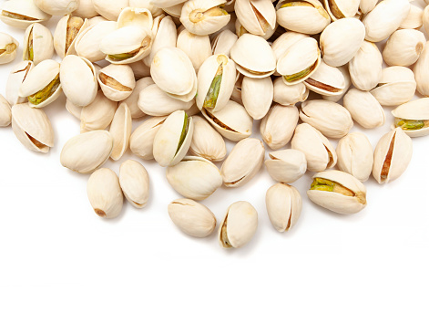 Pistachio nuts isolated on white background.