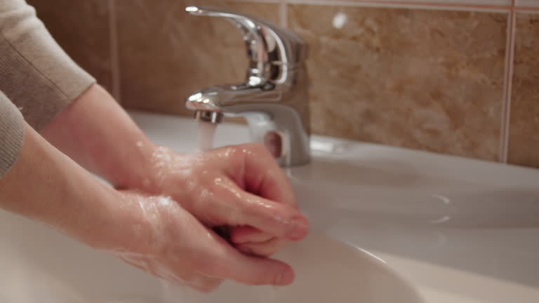 Person cleanses their hands with soap and water understanding cleanses hands significance of pristine skin personal well-being safeguarding against diseases and infections. Person cleanses hands.