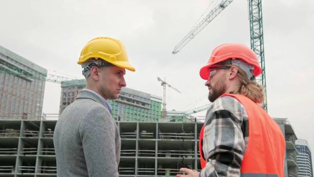 istock Subcontractor talking to general contractor during site inspection 2138221273