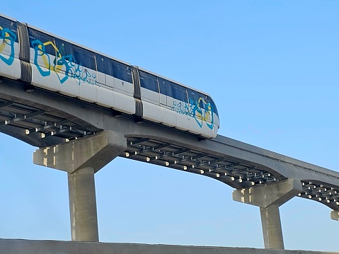 Cairo, Egypt, April 2 2024: installation of Egypt monorail vehicle on its track by a crane, Cairo monorail is a two-line mono rail rapid transit system currently under construction in Cairo, selective focus