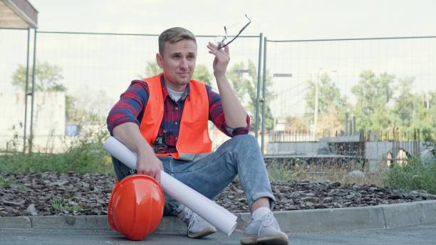 istock Weary builder suffering from headache on building site 2138293194