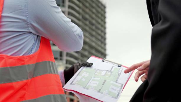 istock Project team conducting inspection of apartment building under construction 2138321439