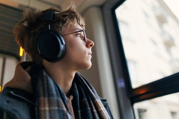 Teenage boy travelling by tramway