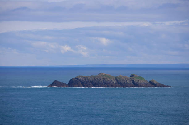 The rocky island off the Cornish Trevose Head Heritage Coast in Cornwall is a rugged and picturesque landform that adds to the dramatic beauty of the coastline, carved by the relentless forces of wind and waves over millennia.