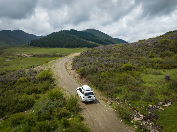 istock Car road trip on the high altitude mountain trail, China 2138366387