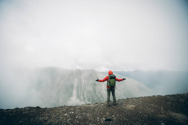 istock Hiking woman on high altitude mountain top 2138401324