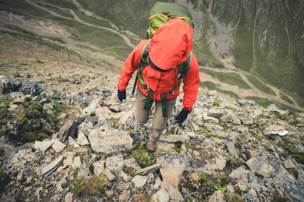istock Hiking woman on high altitude mountain top 2138404472