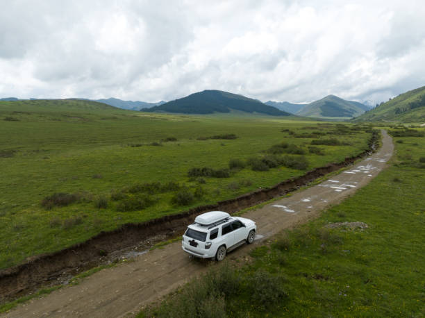 istock Car road trip on the high altitude mountain trail, China 2138435663