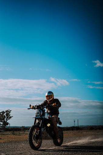 A man riding a motorcycle on the road