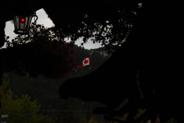 Canadian flag waving in the city of Banff, Canada.