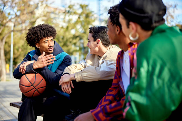 istock Young friends talking before basketball at public park 2138452961