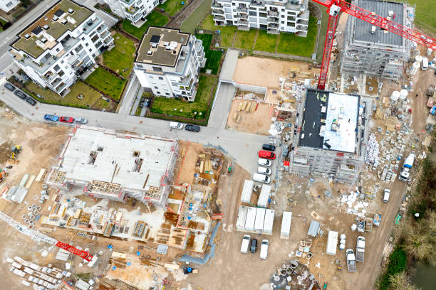 istock Large construction site, cranes and equipment - aerial view 2138454018