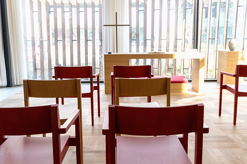 Church room for prayer and privacy with a large cross and chairs for visitors. Herlev hospital, Denmark.