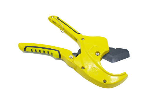 Yellow Multifunction Ratchet type PVC Tube and Plastic Pipe Cutter, Pipe Cutting, Plumbing Pipe, Wire and Trunking cutter scissors isolated on white background. Hand held Carpentry and plumbing tools.