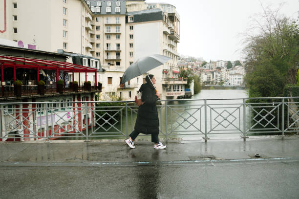 istock Woman with umbrella 2138544557
