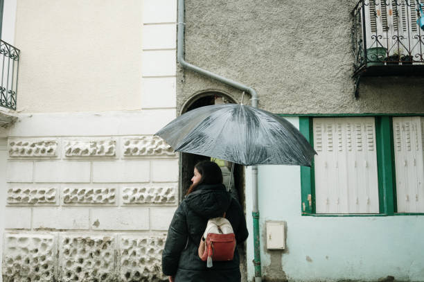 istock Woman with umbrella 2138545603