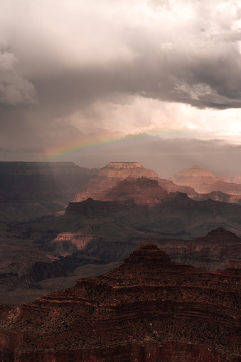 Panoramic photo of Grand Canyon in Arizona with rainbow and cloud