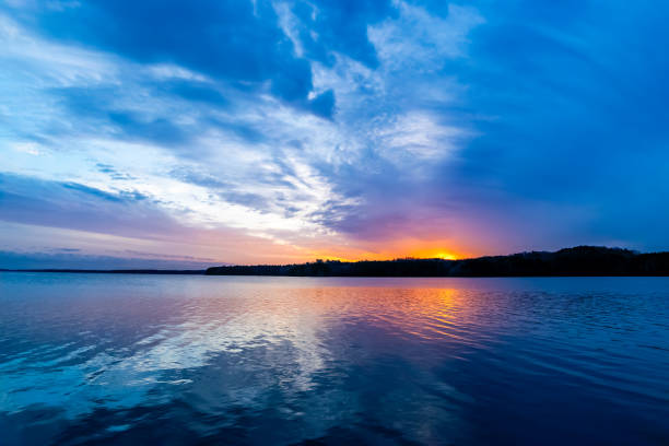 istock Beautiful Sunset over the lake with painted sky 2138569329