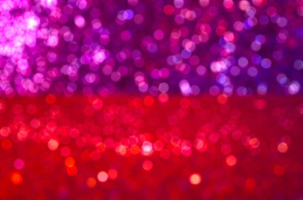 Red violet defocused bokeh light blur sparkling colorful background lights Golden sparks glowing soft focus Luxury template New Year party Xmas Blurred texture Abstract motion template Christmas bokeh