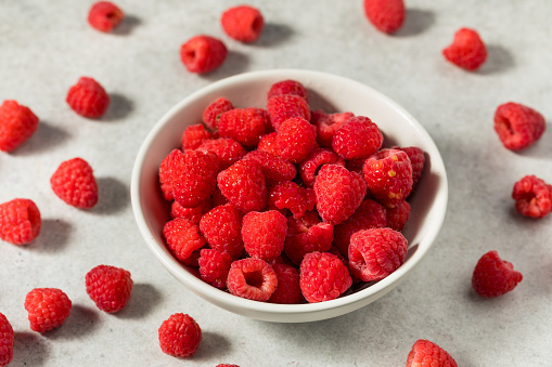 Raw Organic Red Raspberries in a  Bowl