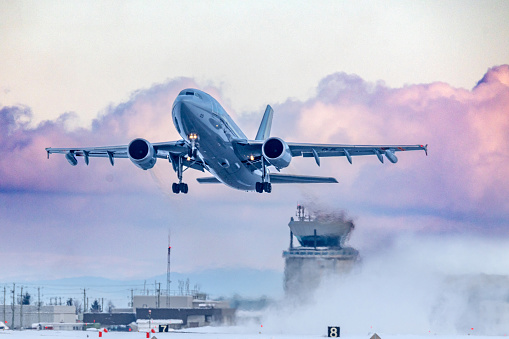 Bagotville, Quebec – January 17, 2024: A Royal Canadian Air Force Airbus A310 CC-150 Polaris, the designation for the civilian Airbus A310-300, is departing the RCAF Bagotville, Quebec, air base following a snowstorm.  The Polaris is used for multi-purpose, long-range jet aircraft for passenger, freight or medical transport and mid-air refueling for the Royal Canadian Air Force.