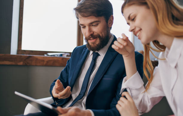 istock business man and woman work colleagues tablet technology work professional 2138644010