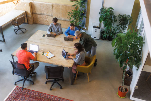 istock High angle view of coworkers working in office. Open space 2138646716